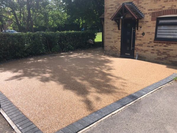 Resin driveway laid with block paving border in Bishops Cleeve, Gloucestershire