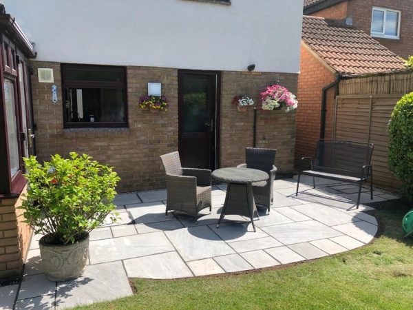 Our patio team installing a patio in Brockworth